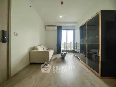 Modern living room with sleek furniture and balcony view
