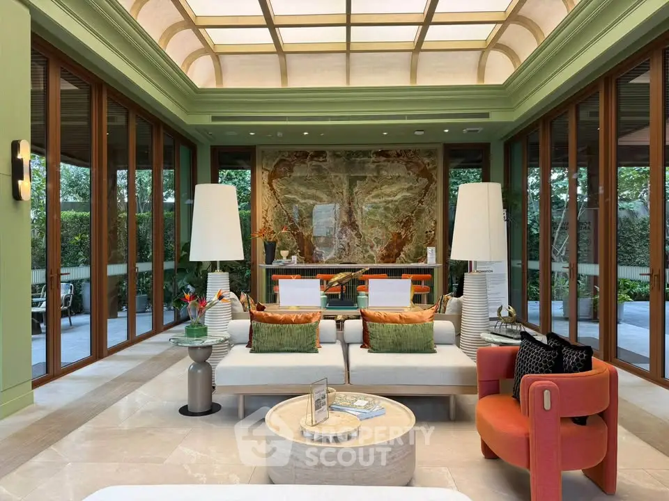 Luxurious living room with elegant decor and large windows offering garden views