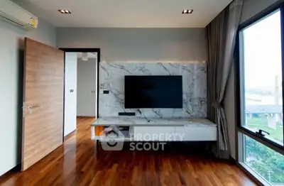 Modern living room with marble TV wall and large window view