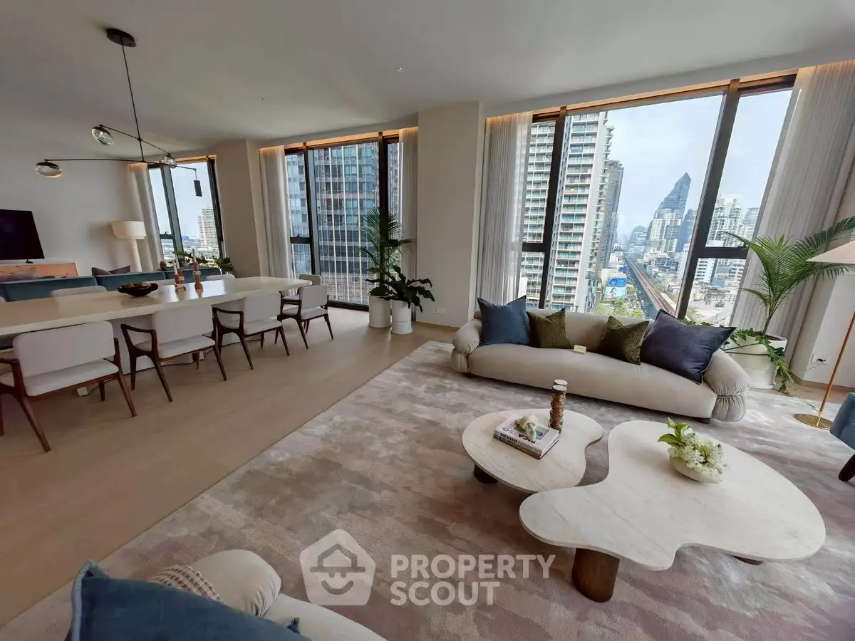 Luxurious open-plan living room with stunning city view and elegant decor