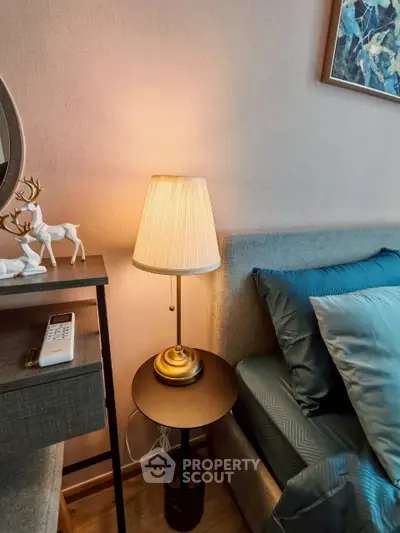 Cozy bedroom corner with elegant lamp and stylish decor