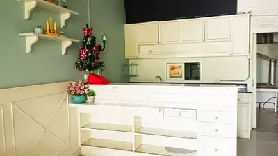 Charming kitchen with festive decor and white cabinetry