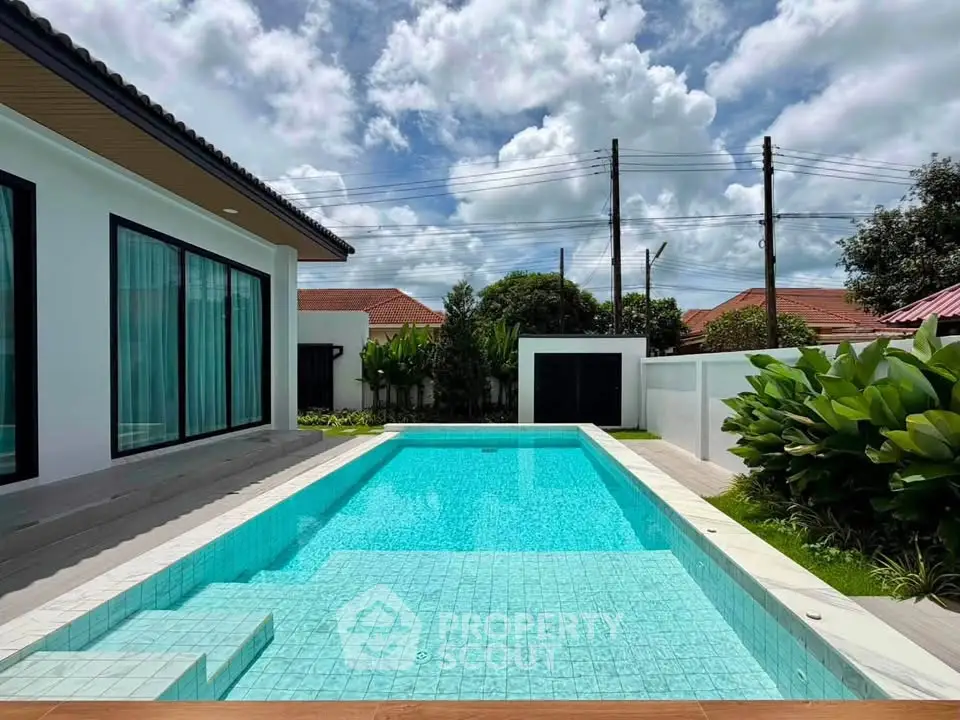 Luxurious modern home with private pool and lush garden, perfect for relaxation and entertaining.