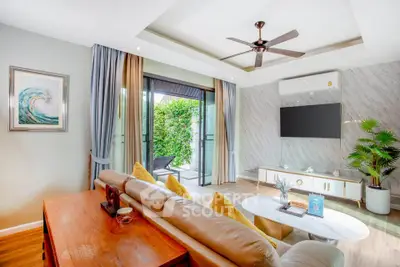 Luxurious living room with modern decor and garden view