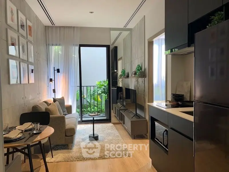 Modern living room with open kitchen and balcony view, stylish decor and natural light.