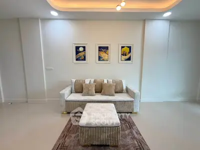 Modern living room with elegant sofa and stylish decor in a contemporary apartment.