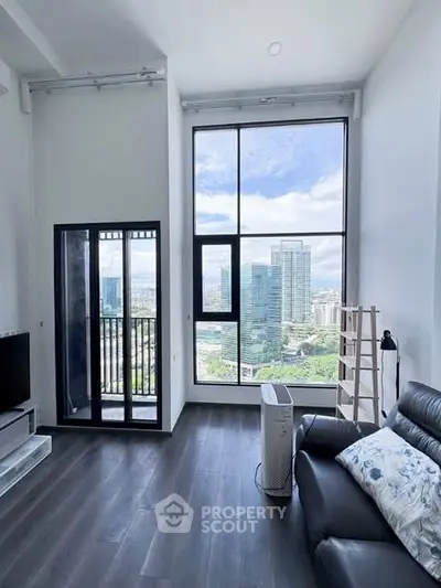 Stunning high-rise living room with floor-to-ceiling windows and cityscape view.