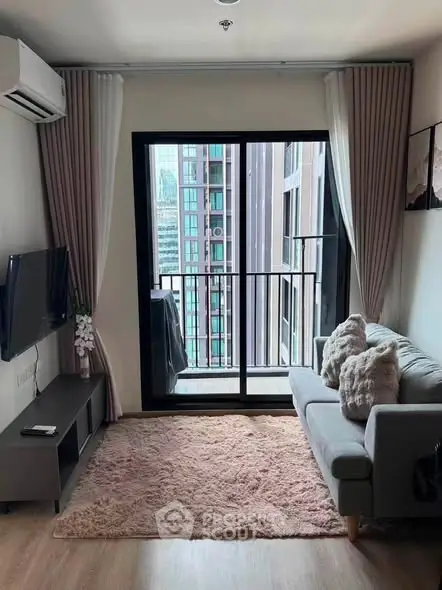 Cozy living room with modern decor and balcony view in urban apartment