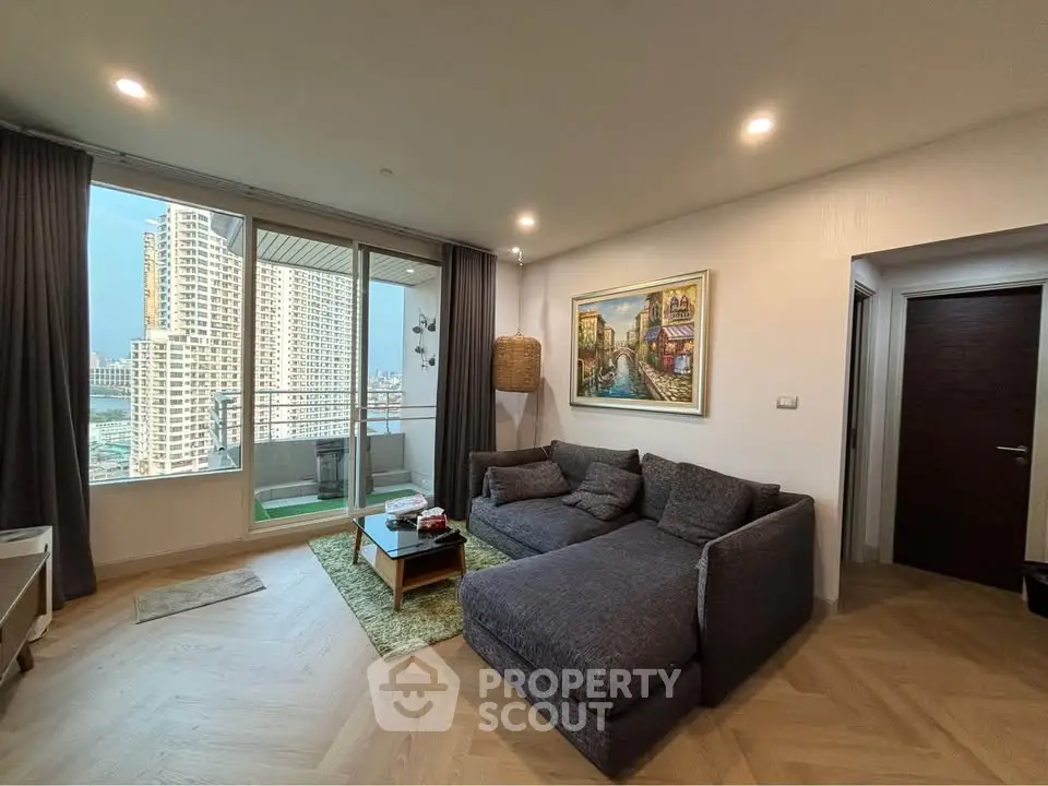 Spacious living room with large balcony and city view in modern apartment
