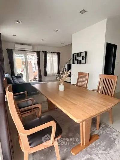 Spacious living room with elegant dining area and modern decor