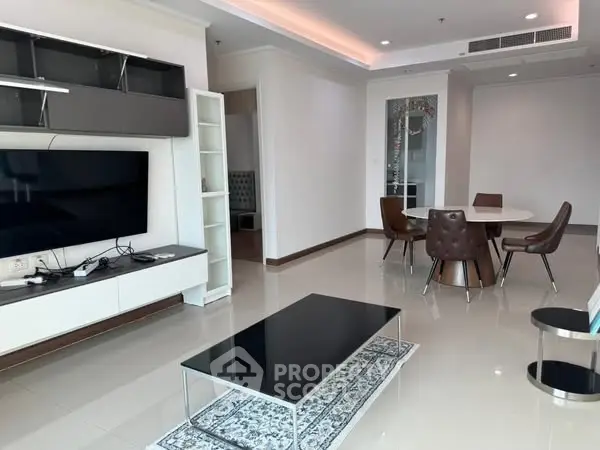 Spacious modern living room with sleek furniture and dining area