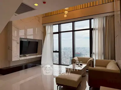 Luxurious high-rise living room with panoramic city views and elegant modern furnishings.