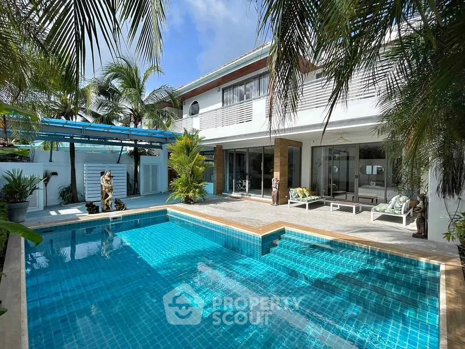 Luxurious modern villa with private pool and tropical garden oasis