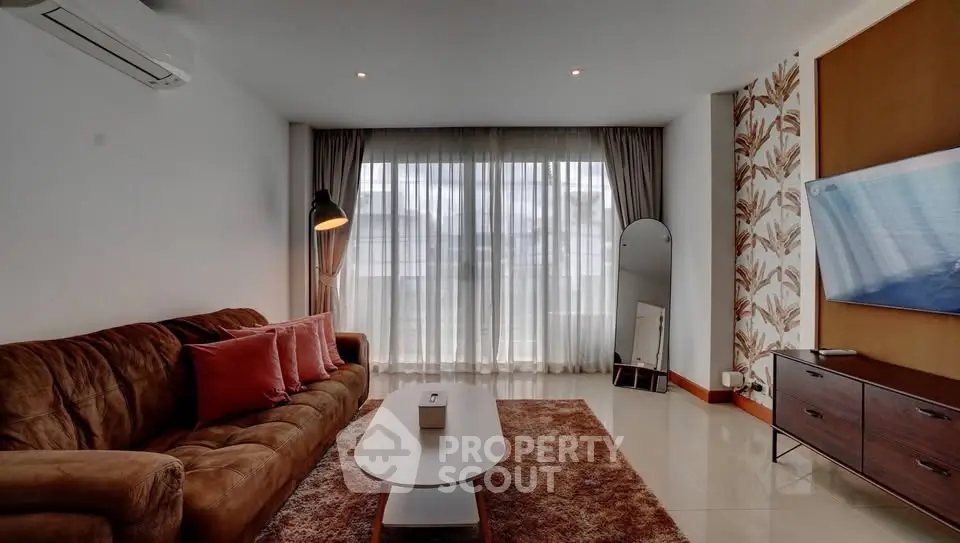 Stylish living room with modern decor and large window