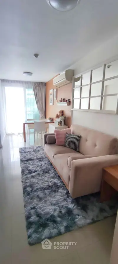 Chic living room with plush sofa and stylish decor, perfect for modern urban living.