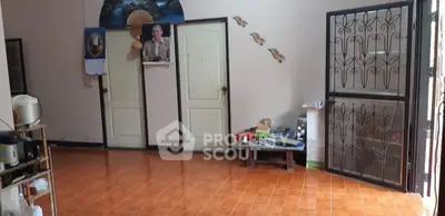 Spacious interior room with tiled floor and decorative wall accents