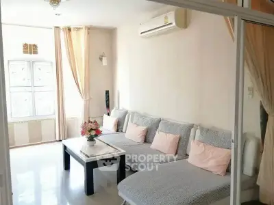 Bright and cozy living room with modern decor and air conditioning