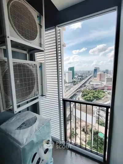 Stunning city view from a high-rise balcony with air conditioning units.