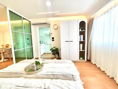 Bright and modern bedroom with open layout and stylish decor