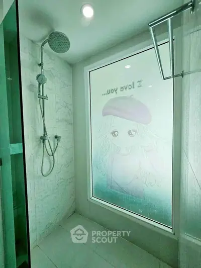 Modern bathroom with glass shower and artistic window design