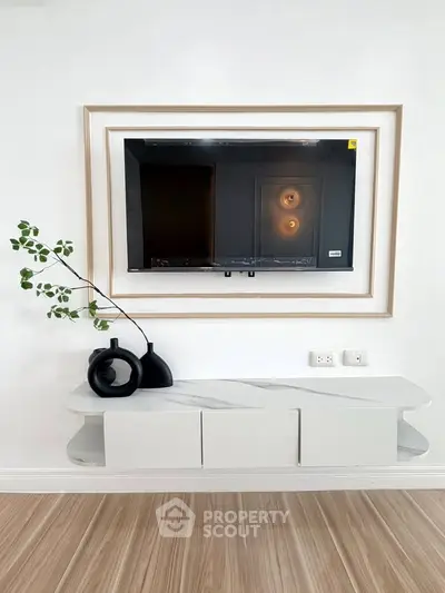 Modern living room with stylish TV setup and elegant decor