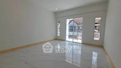Spacious empty room with large windows and glossy tiled floor, perfect for customization.