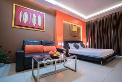 Modern bedroom with stylish decor and cozy seating area