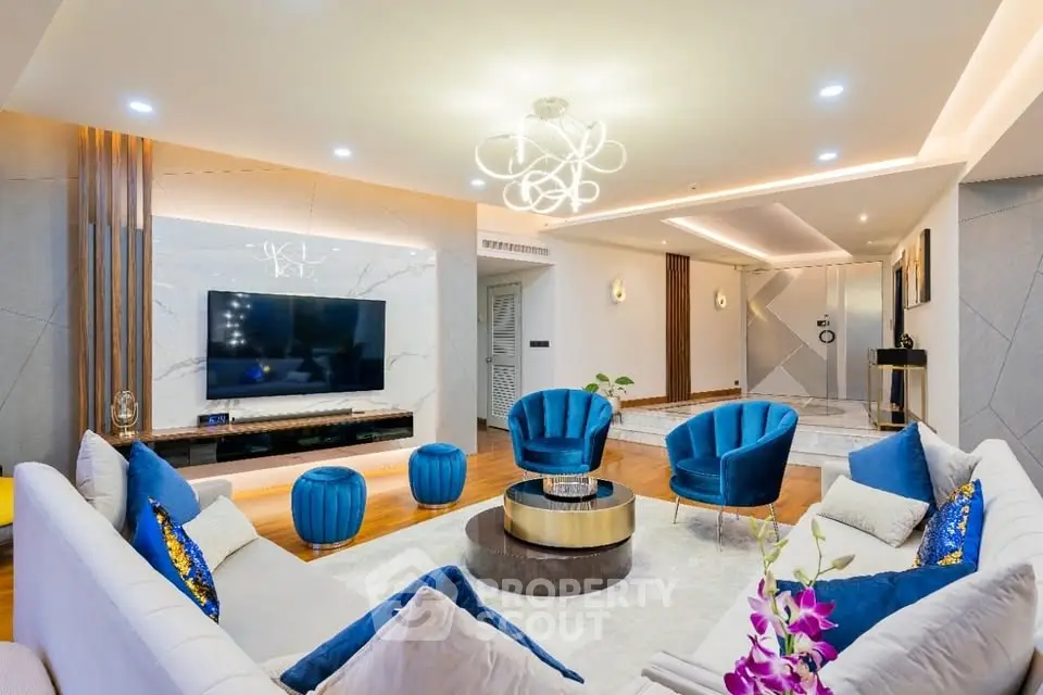 Luxurious modern living room with elegant blue accents and stylish lighting