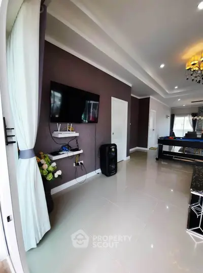 Modern living room with wall-mounted TV and elegant decor