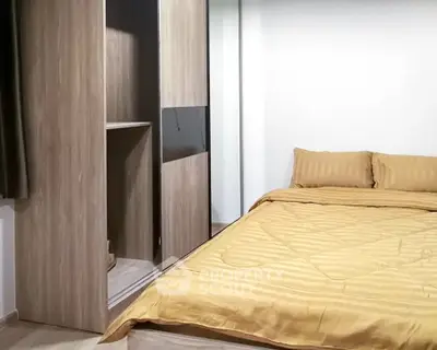 Cozy bedroom with modern wooden wardrobe and stylish bedding