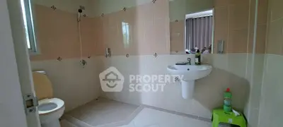 Spacious bathroom with modern fixtures and neutral tiles
