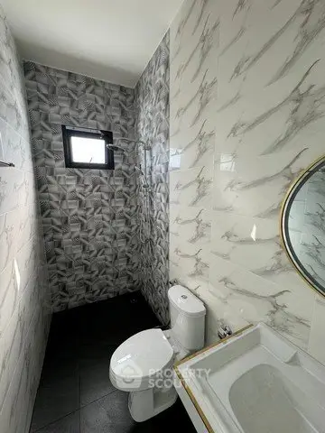 Modern bathroom with stylish tile design and sleek fixtures