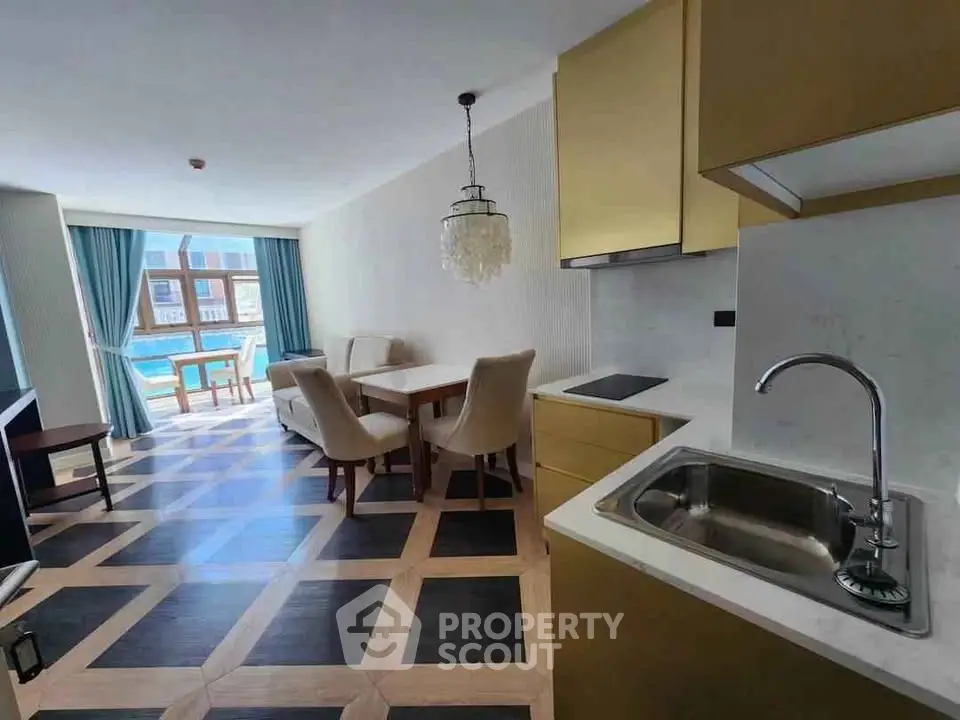 Luxurious open-plan living room with elegant dining area and pool view