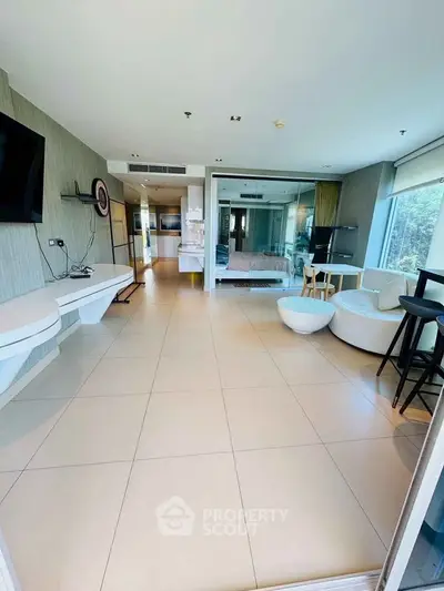 Spacious modern living room with open layout and large windows