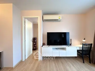 Modern living room with sleek TV setup and air conditioning
