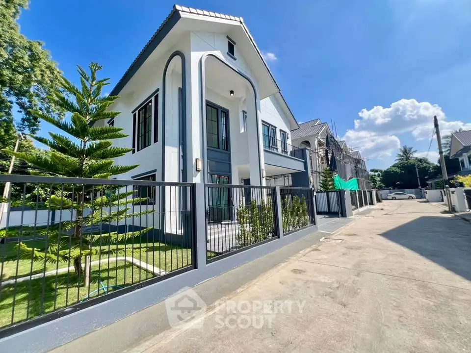 Stunning modern two-story house with spacious garden and elegant facade in a serene neighborhood.