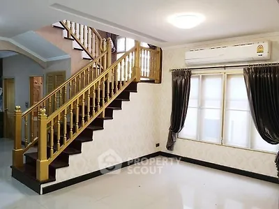 Elegant interior with wooden staircase and bright natural light in modern home