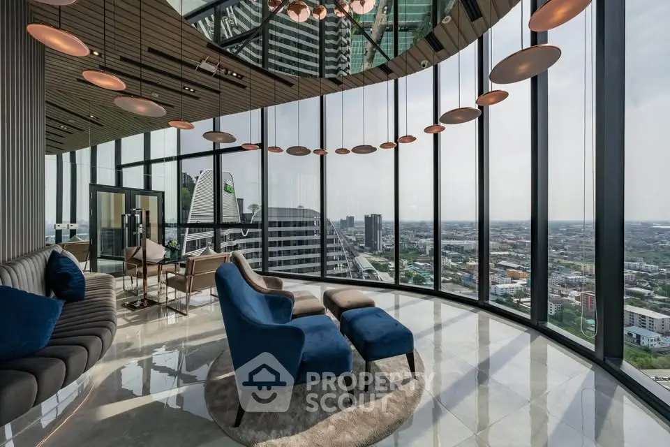 Luxurious modern living room with panoramic city views and elegant furnishings.
