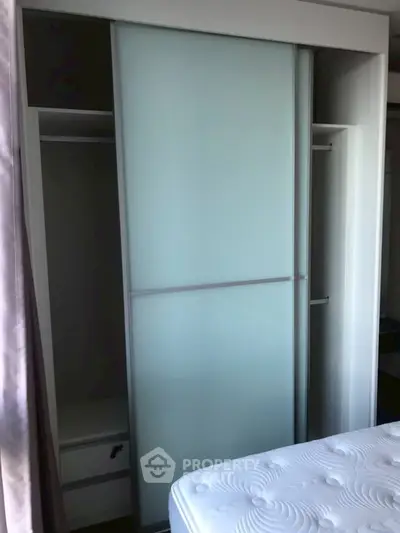 Modern bedroom with sliding wardrobe and comfortable mattress