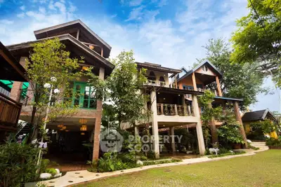 Charming multi-level house with lush greenery and unique architectural design, perfect for nature lovers.