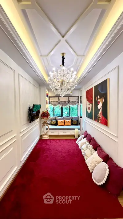 Luxurious living room with elegant chandelier and vibrant decor