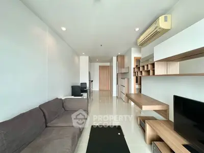 Modern living room with sleek furniture and air conditioning in a stylish apartment.
