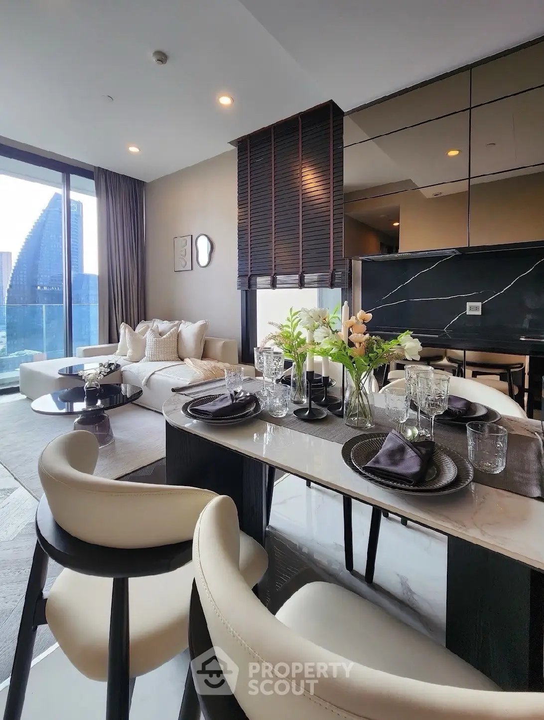 Luxurious modern living room with elegant dining area and stunning city view.
