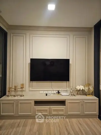 Elegant living room with modern TV setup and stylish decor