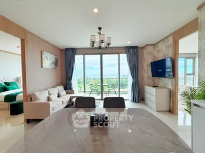 Spacious modern living room with large windows and balcony view
