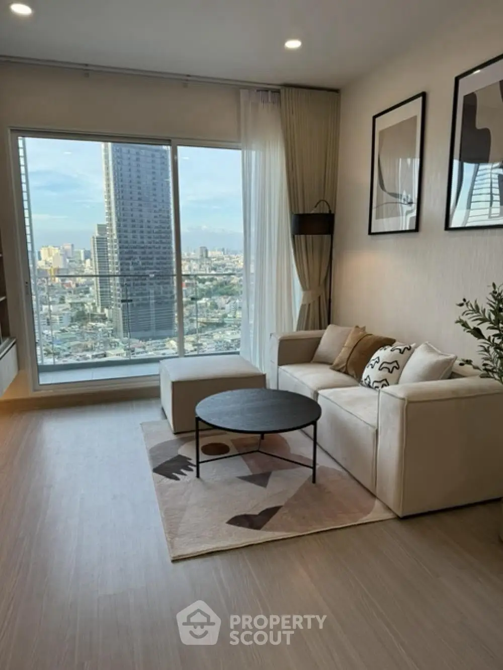 Modern living room with stunning city view and stylish decor
