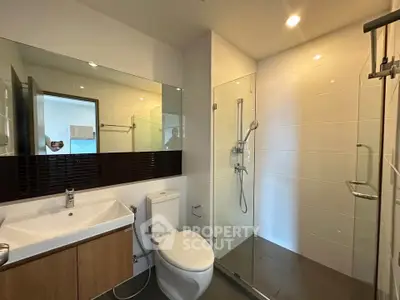Modern bathroom with glass shower and sleek fixtures