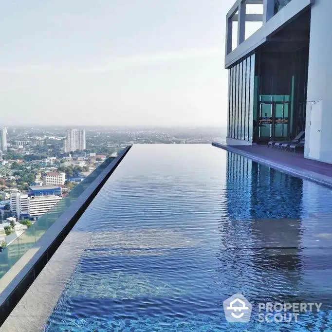 Luxurious rooftop infinity pool with stunning city skyline view