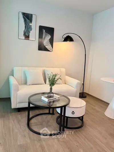 Chic modern living room with stylish decor and cozy seating area, perfect for relaxation and entertaining.