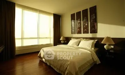 Luxurious bedroom with elegant decor and natural light